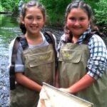 Bad River Youth Clean Up with two young girls